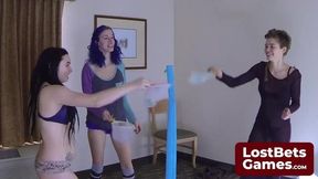 Brunette babe loses strip game, gets naked for lesbian fun