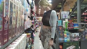 Lady flashes boobs in book store while browsing in transparent top