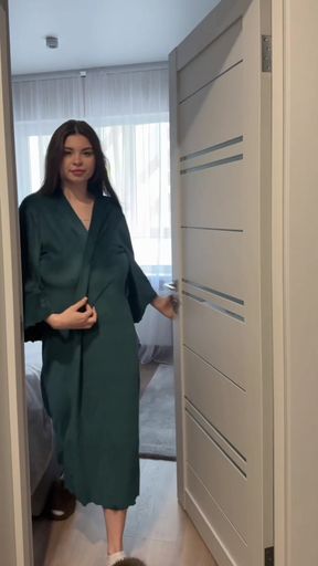 Woman in robe opening closet door