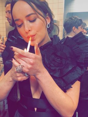 Smoking in a black dress