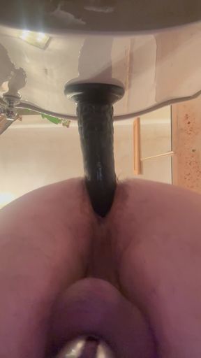 Caged and dildo