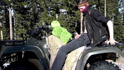 Biker fucks plush toy while on ATV four wheeler in the wilderness.