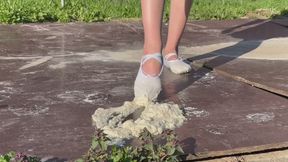 girl in dancing ballet flats is training, during training she steps on a sticky mass and dirties her ballet flats, but she cannot stop during training