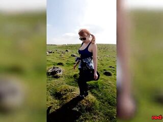 Breasty redhead older shows off her large melons during the time that out on a hike