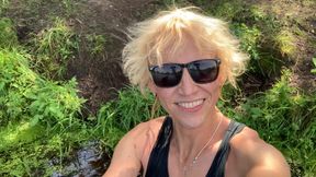 Trans girl Alexa Cosmic swimming and playing in the lake wearing black short and blue top
