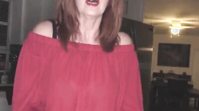 Redhead cougar is filmed POV-style while stroking and riding hard cock