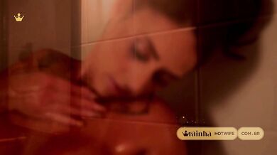 Busty brunette baths for the photographer getting her top wet