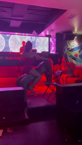 Dancing duo in a club