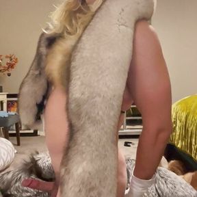 Fur slut tries on fur coats