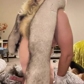 Fur slut tries on fur coats