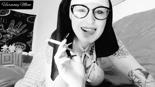 Horny nun smokes a cigarette