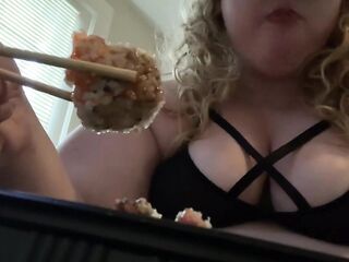 Overweight floozy eats sushi