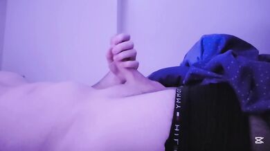 I lay down on the bed and started caressing and masturbating my cock