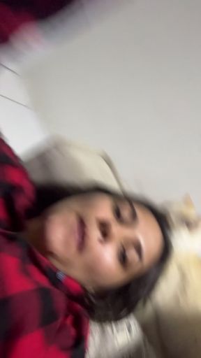 Cute girl in red plaid shirt lying down