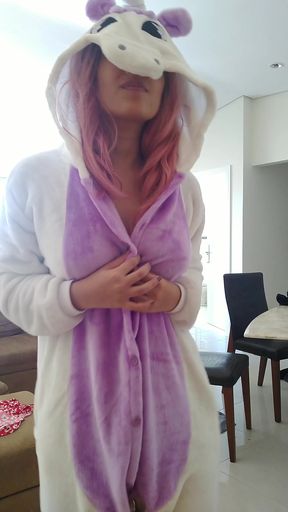 Curvy blonde solo in a purple unicorn onesie