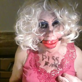 Sissy cd whore, Sarah, humiliates herself, by drinking own piss, while mouth gagged