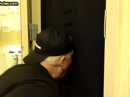 Gloryhole BJ DILF sucks besides open door of toilet