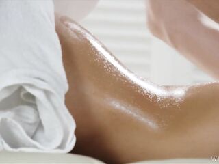 Warm Oil Oozes Down Her Curves as the Masseur Works Her Legs and Lower Back