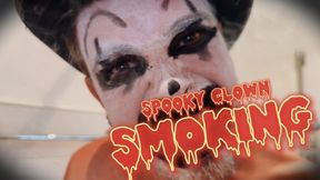Spooky clown smoking