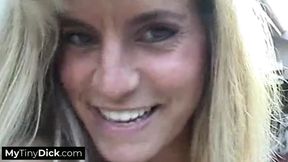 A sexy blonde MILF sucking on his pathetic small dick