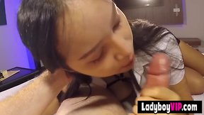 Pretty and cute faced asiatic ladyboy baby in a uniform
