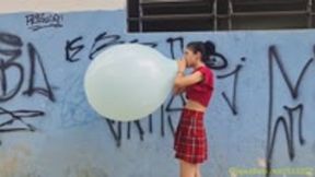 Emma Blows to Pop a 24-Inch Balloon