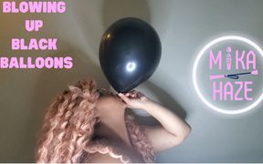 Blowing up black balloons