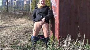 Dumpy brunette chick pisses near rail-track outdoors