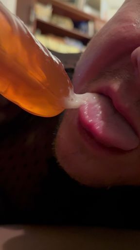 Sucking off a dildo imagining it's the real thing.