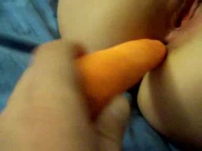 A carrot travelling in the pussy and asshole of my latina