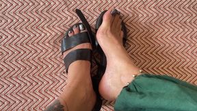 showing off beautiful feet in new sandals