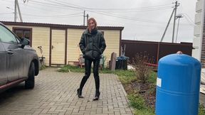 A girl in high-heeled boots decided to get them knee-deep in dirt and mud