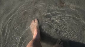 I walk barefoot in the water