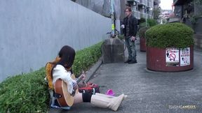She was playing a guitar on the street and subsequently engaged in intense sexual activity