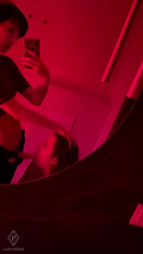 Lesbian strapon fucking in a public toilet in a club