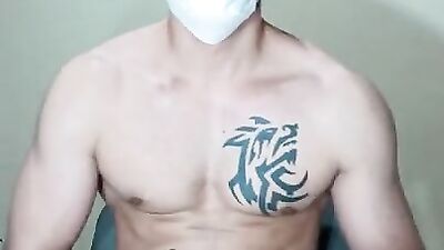 Handsome masked sude is jerking off in front of the phone