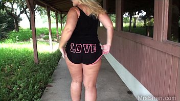 Naughty MILF flashes her big ass in a public gazebo