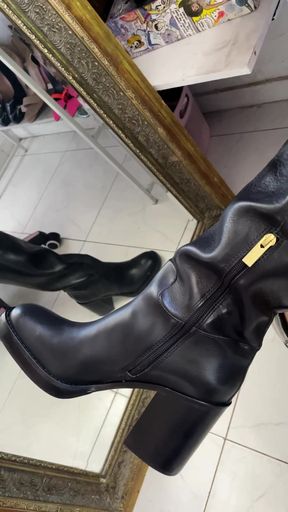 Curvy brunette in knee-high boots takes control