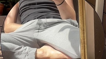 Amateur boy wets his grey sweatpants