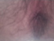 A hairy Japanese man squats and masturbates. The contraction of his anus at moment of ejaculation