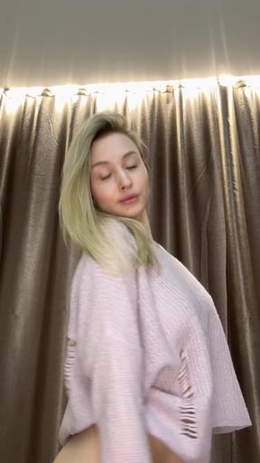 Blonde woman in pink sweater