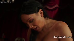 Asian trans person in lingerie interacting with submissive partner