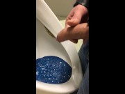 dirty boy pissing in dirty urinal
