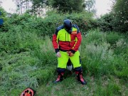 Forest Worker Pup pawing off in gear and boots (outdoors)