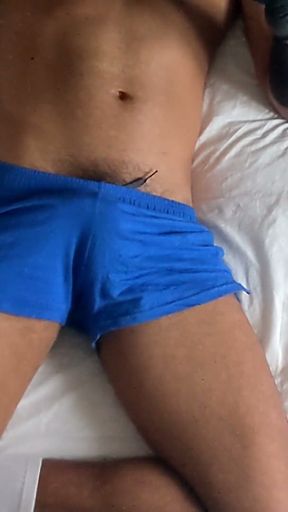 Muscle Man Streams Big Bulge In Blue Shorts   Clip 2