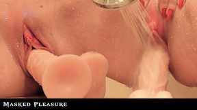 A Dildo in her Cunt and a Shower Jet Stream at her Clit drives her to a huge Orgasm after shaving her Pussy