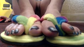Closeup toe wiggling flip flops nude