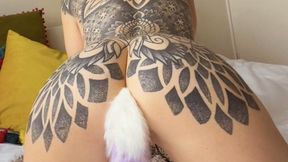 Redhead plays with her pussy while her fluffy tail is stuffed in her ASS