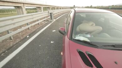 MILF masturbates wild on the highway with her big ass out