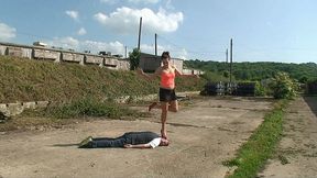 Sophie Trampling Her Slave In Red High Heels On The Concrete Floor